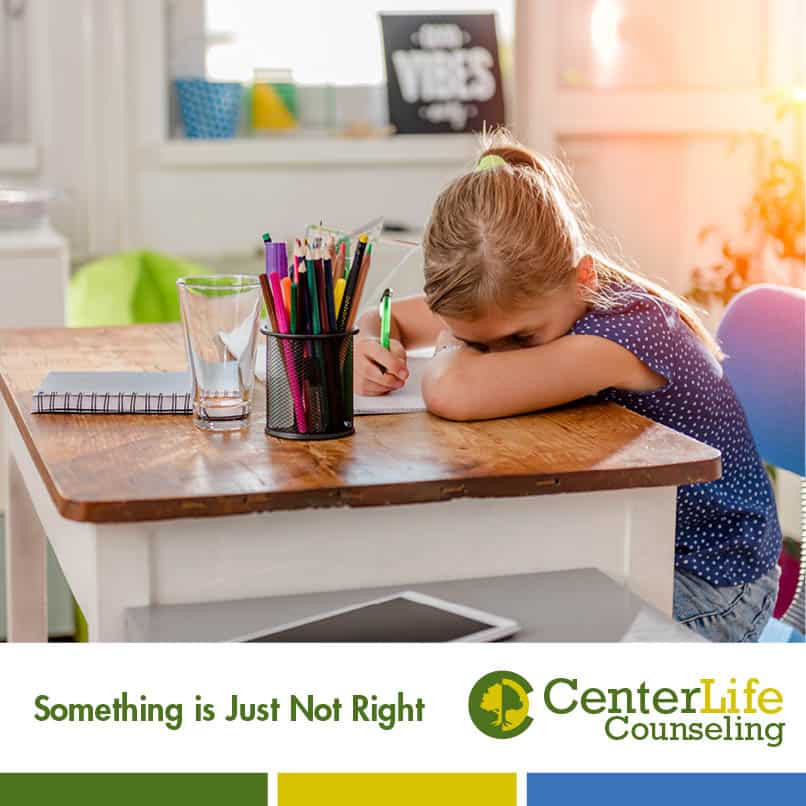 Child with head on desk